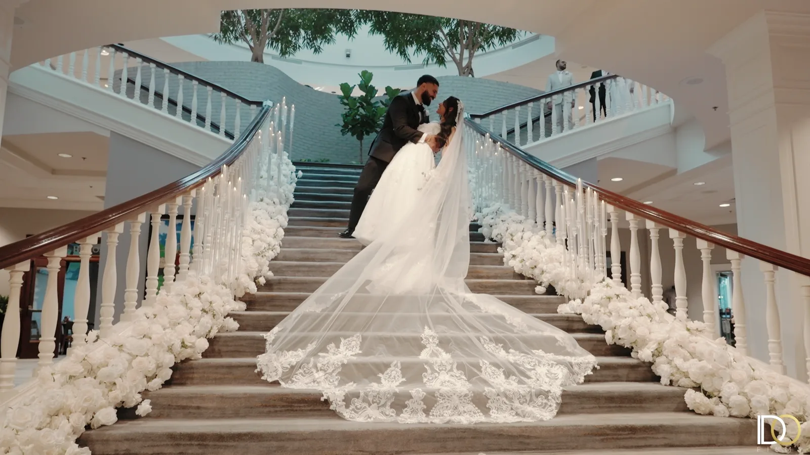 A frame from Antoun and Marina's same-day edit, the couple on the flower-lined staircase.