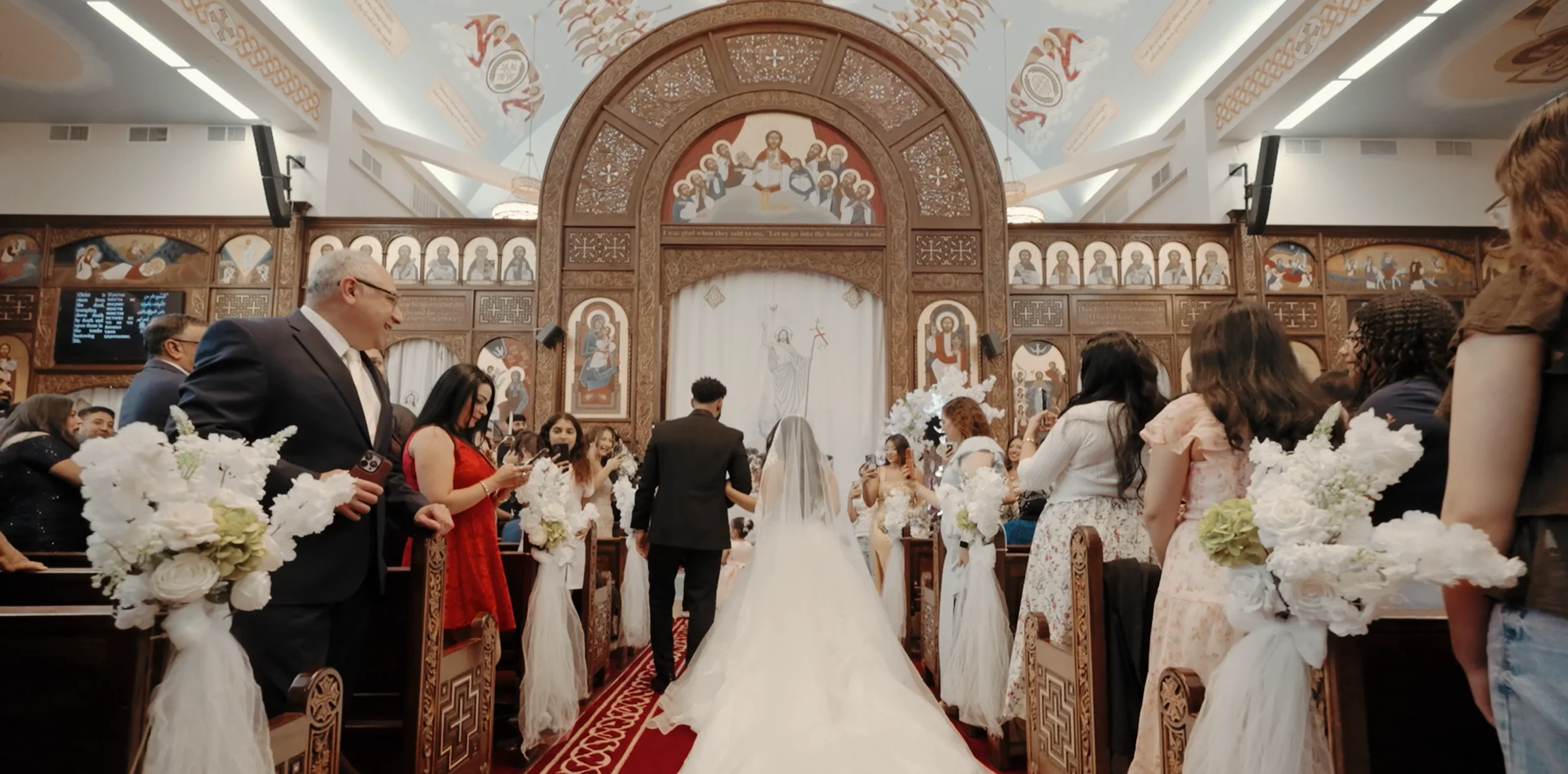 Abram and Amira entering their Coptic Orthodox church