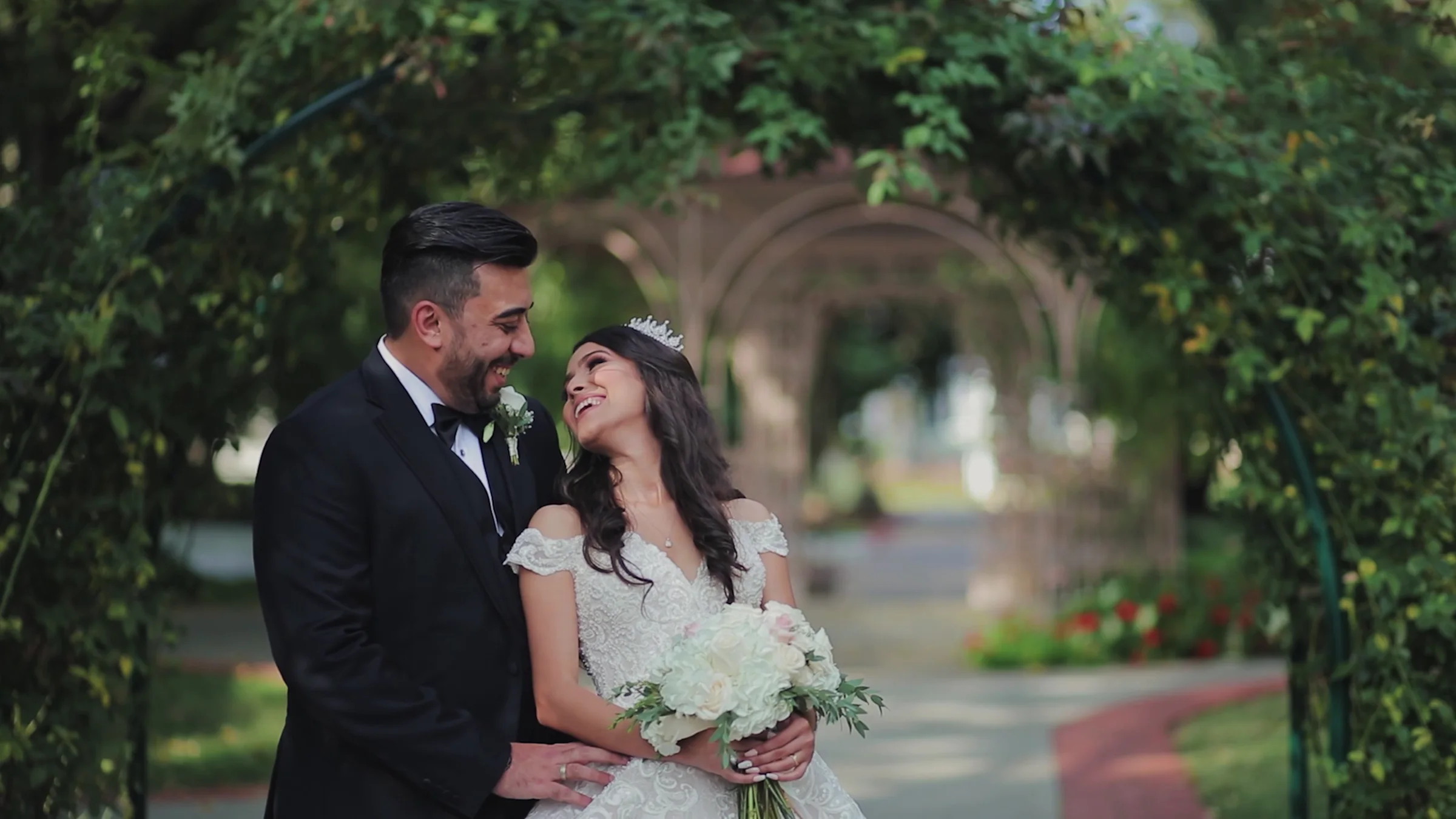 Couple in a Nashville garden at golden hour on their wedding day
